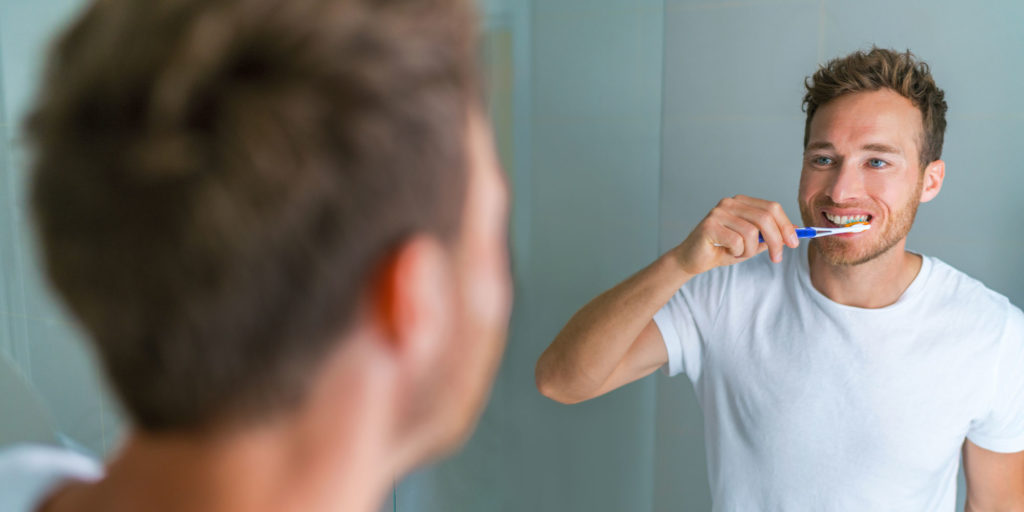 patient brushing teeth for preventative